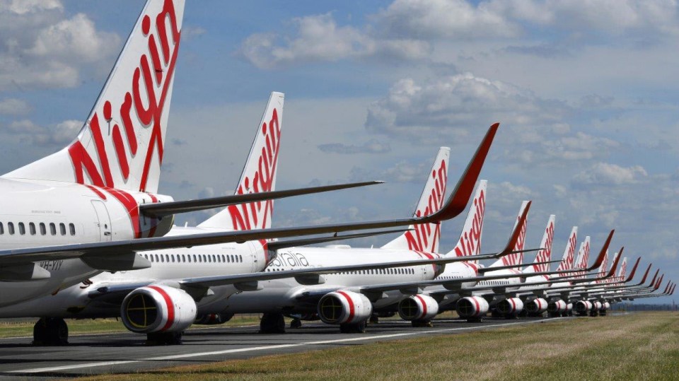 Letadla společnosti Virgin Australia zaparkovaná na letišti v Brisbane